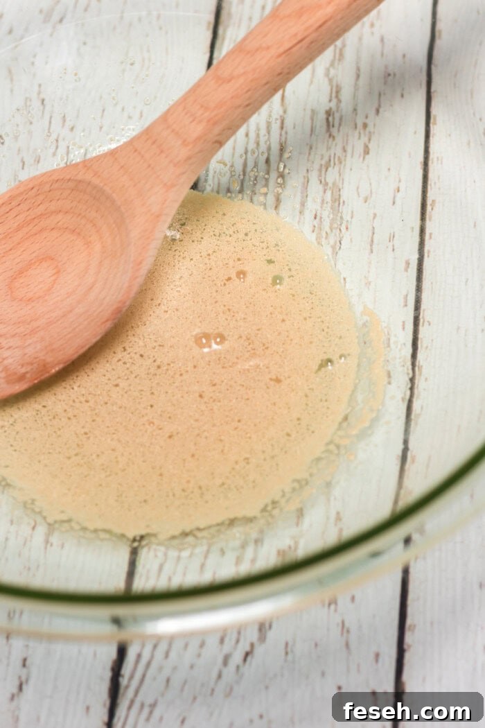 yeast mixture in a glass bowl