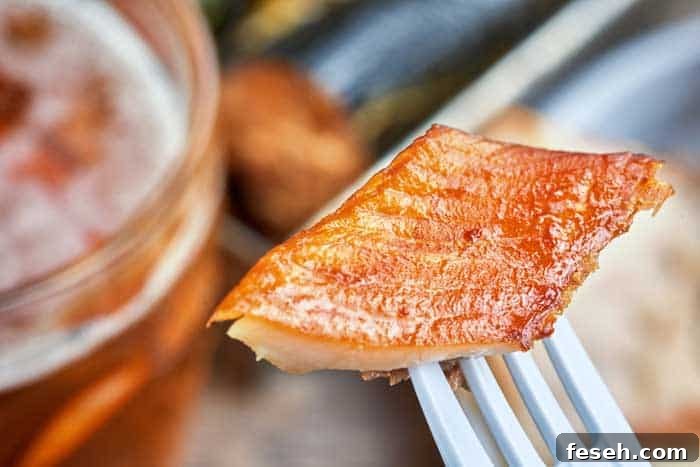 beautiful orange colored mackerel piece on fork
