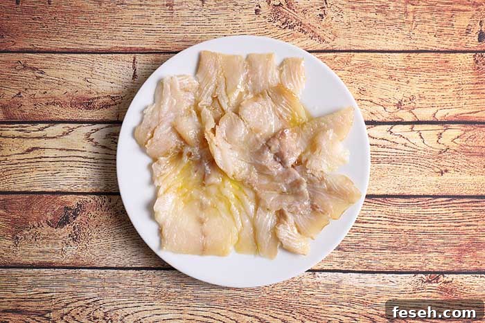smoked cod pieces served on plate