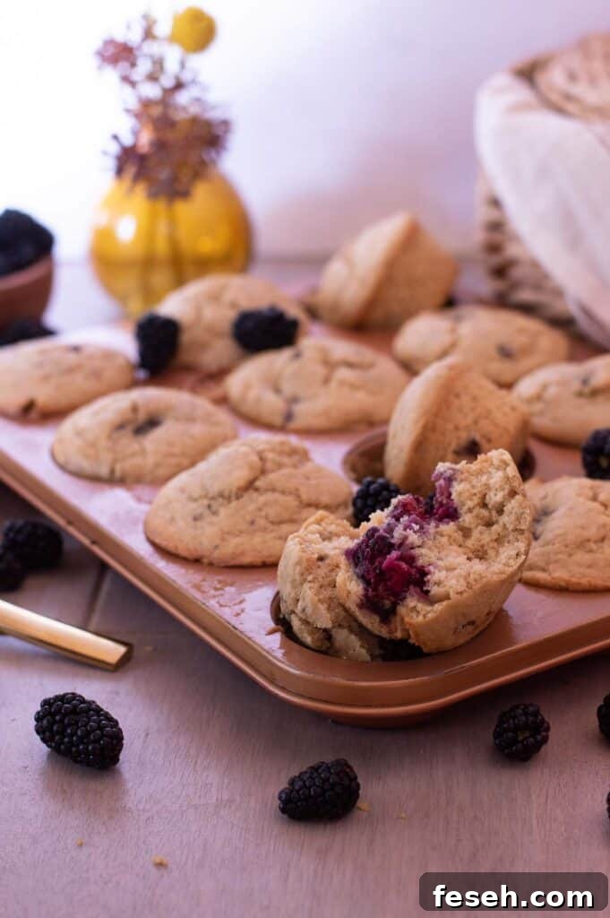 Gluten Free Blackberry Muffins in a copper muffin tin