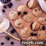 Gluten Free Blackberry Muffins in a copper muffin tin