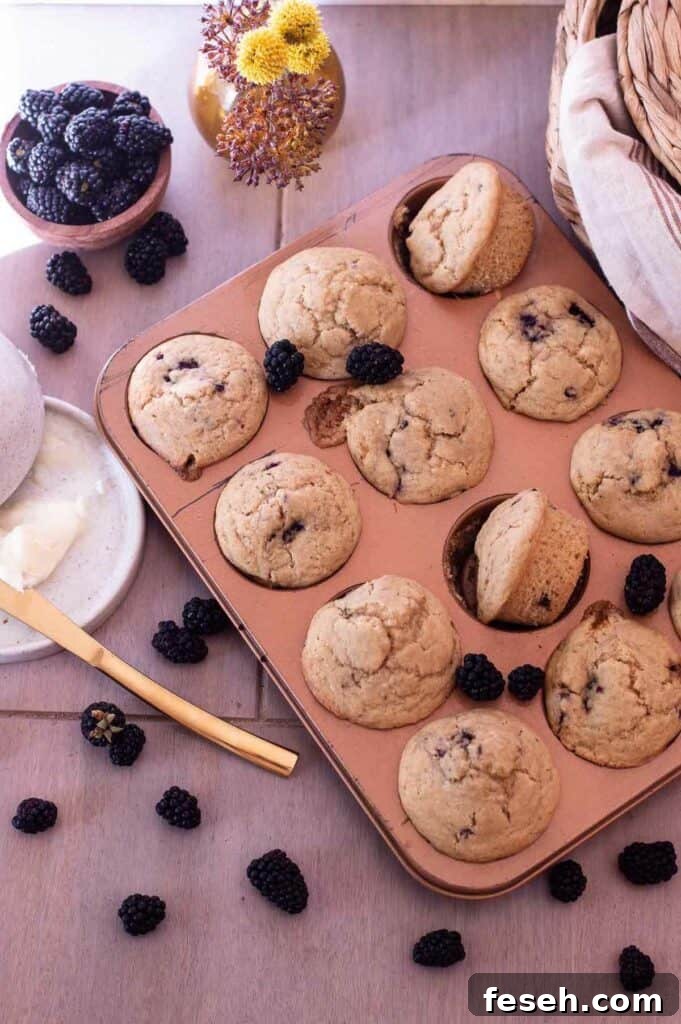 Gluten Free Blackberry Muffins in a copper muffin tin