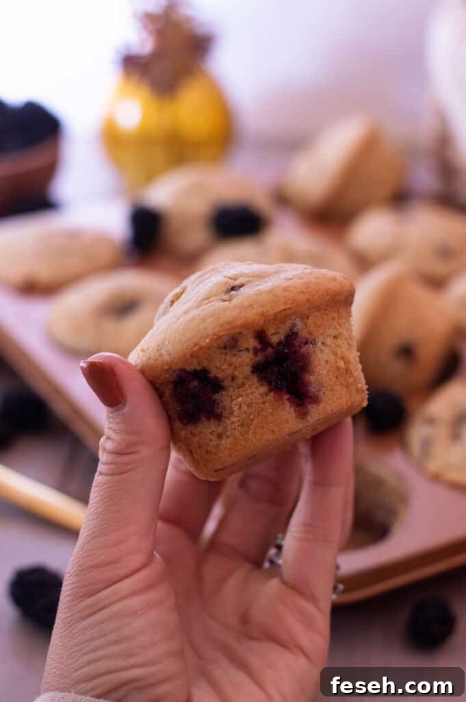 Gluten Free Blackberry Muffins in a hand