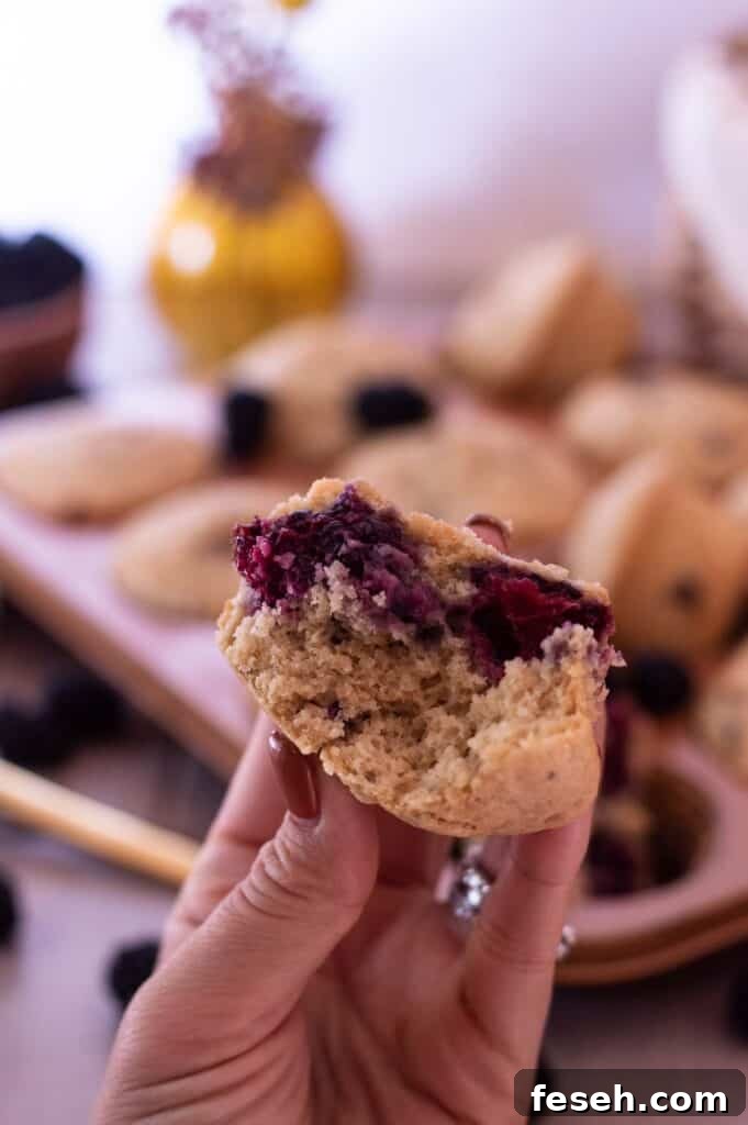 Gluten Free Blackberry Muffins in a hand