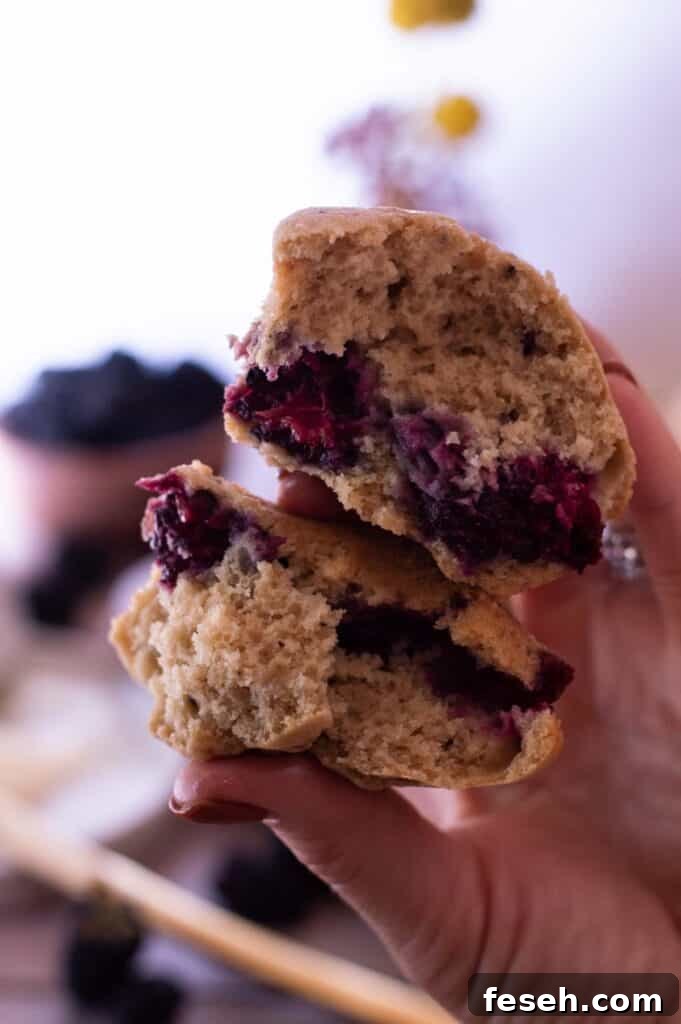 Gluten Free Blackberry Muffins in a hand