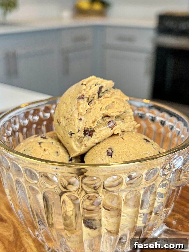 A glass of scoops of cookie dough.