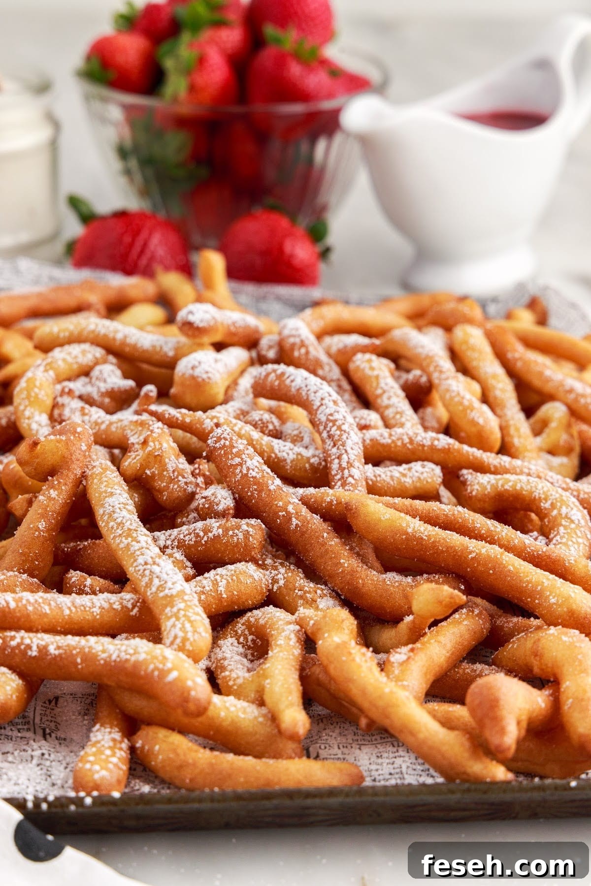 Front view of a platter of Funnel Cake Fries.