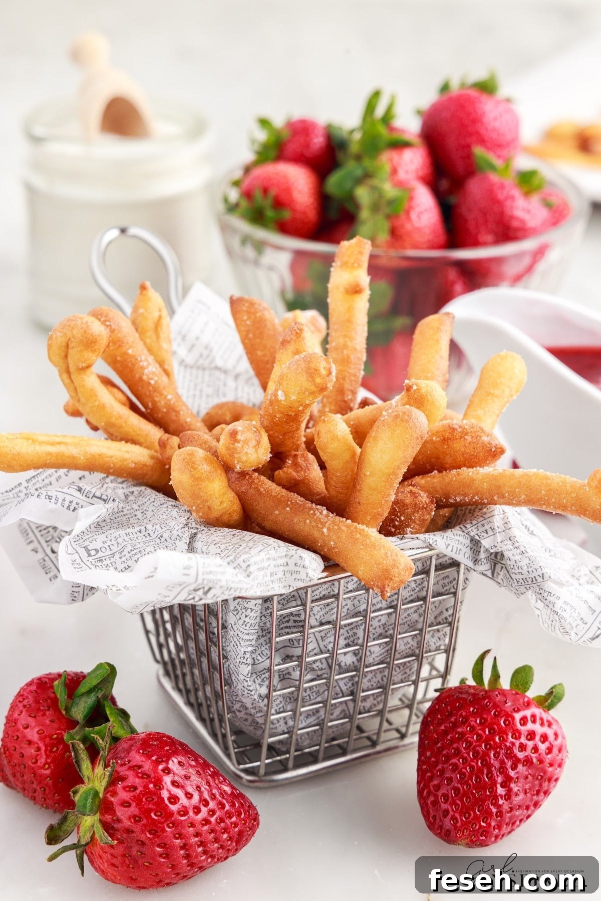 A small basket of Funnel Cake Fries.