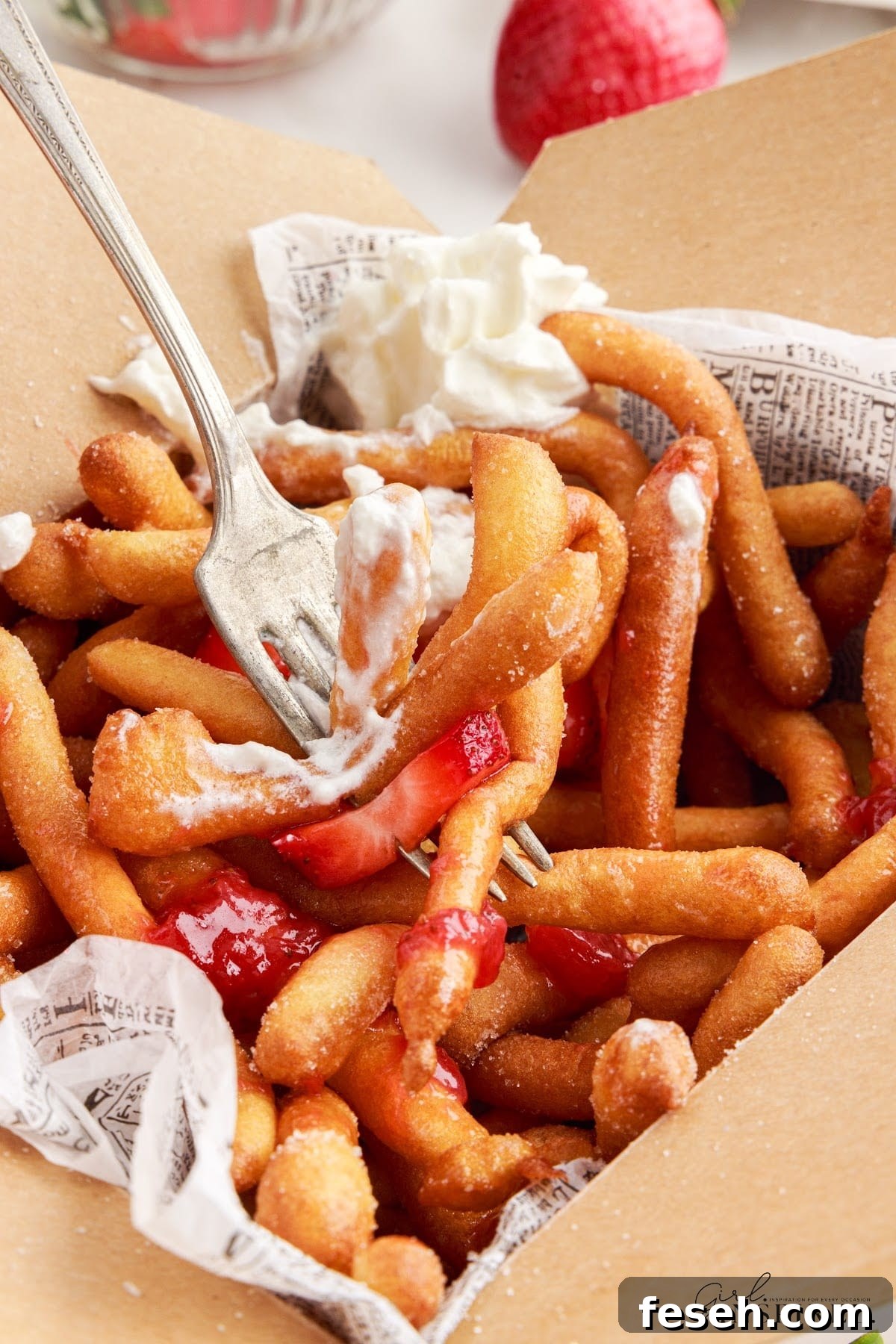 A forkful of Funnel Cake Fries.