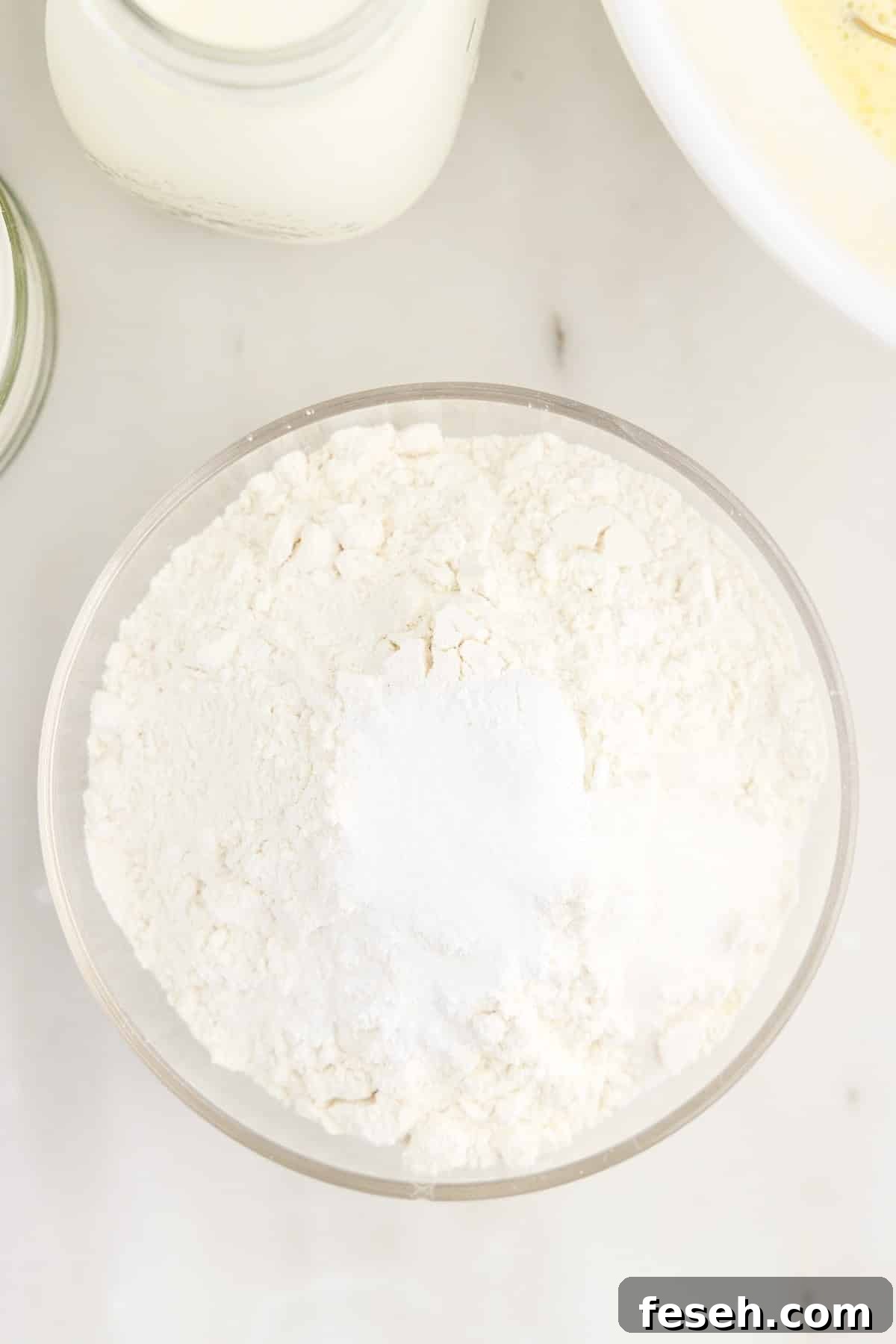 Flour, salt, baking powder, and sugar in a bowl.