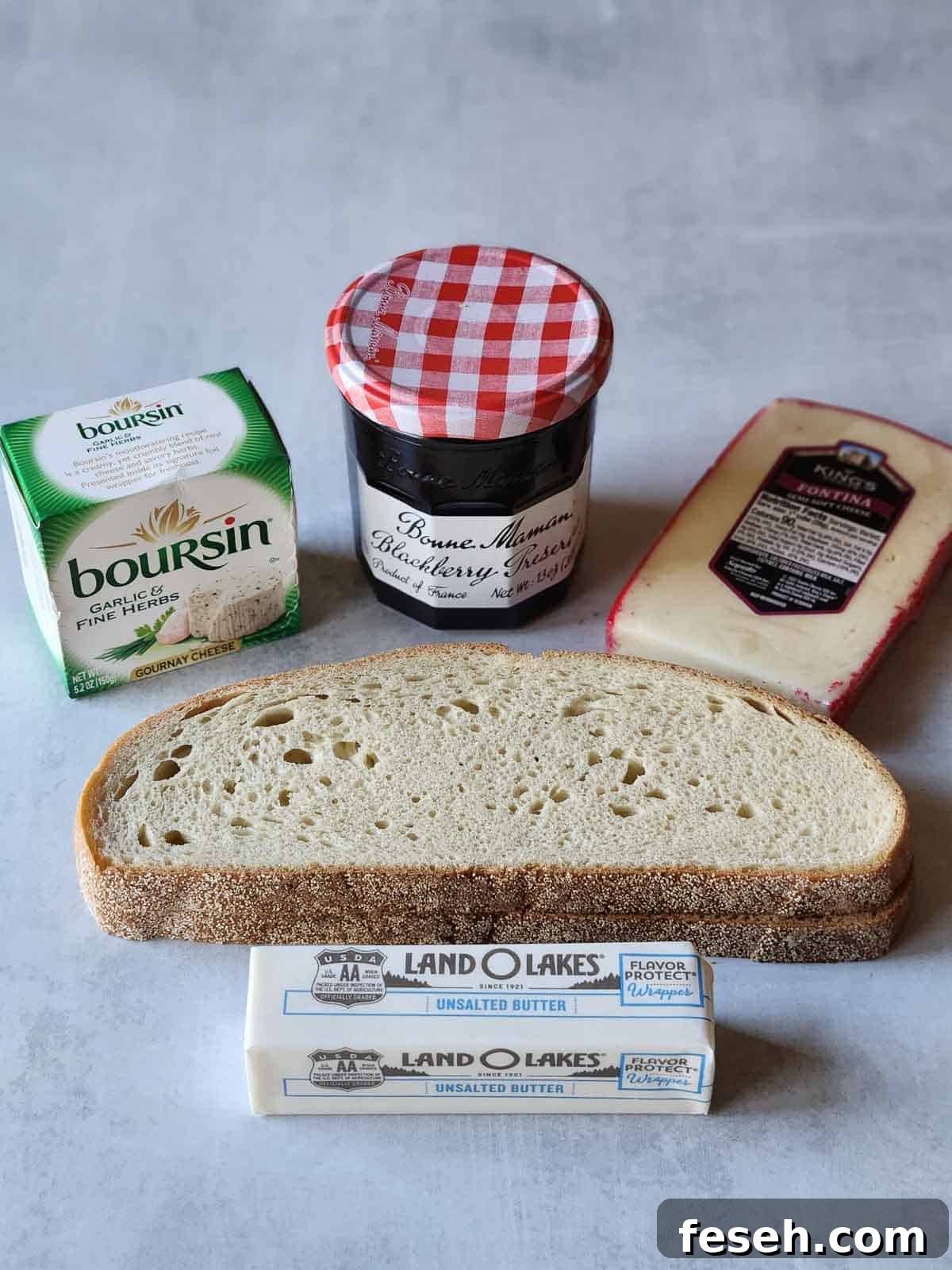 Ingredients for blackberry Boursin grilled cheese on a grey surface.