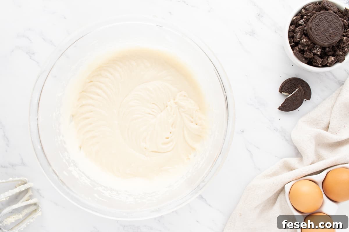white cupcake batter in a glass bowl.