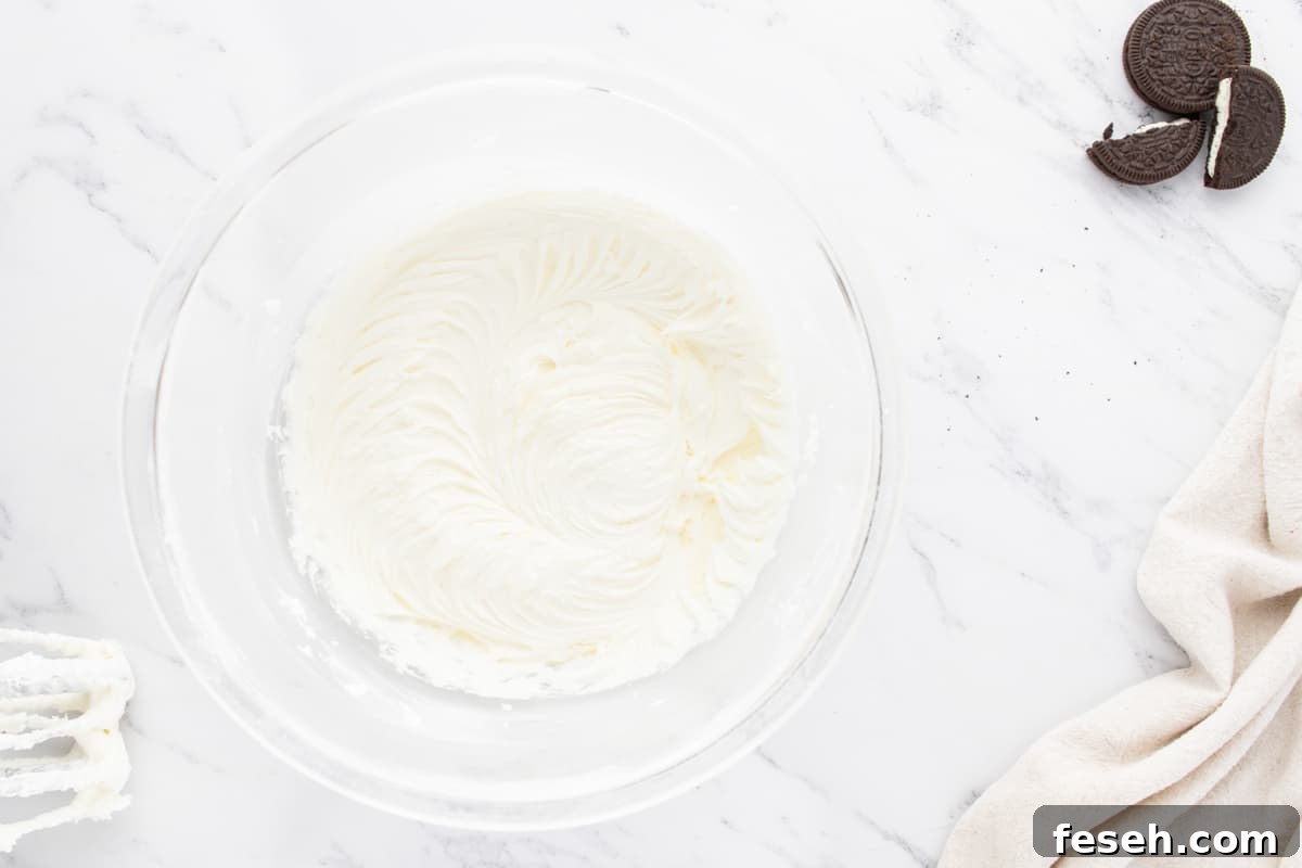 whipped buttercream frosting in a glass bowl.