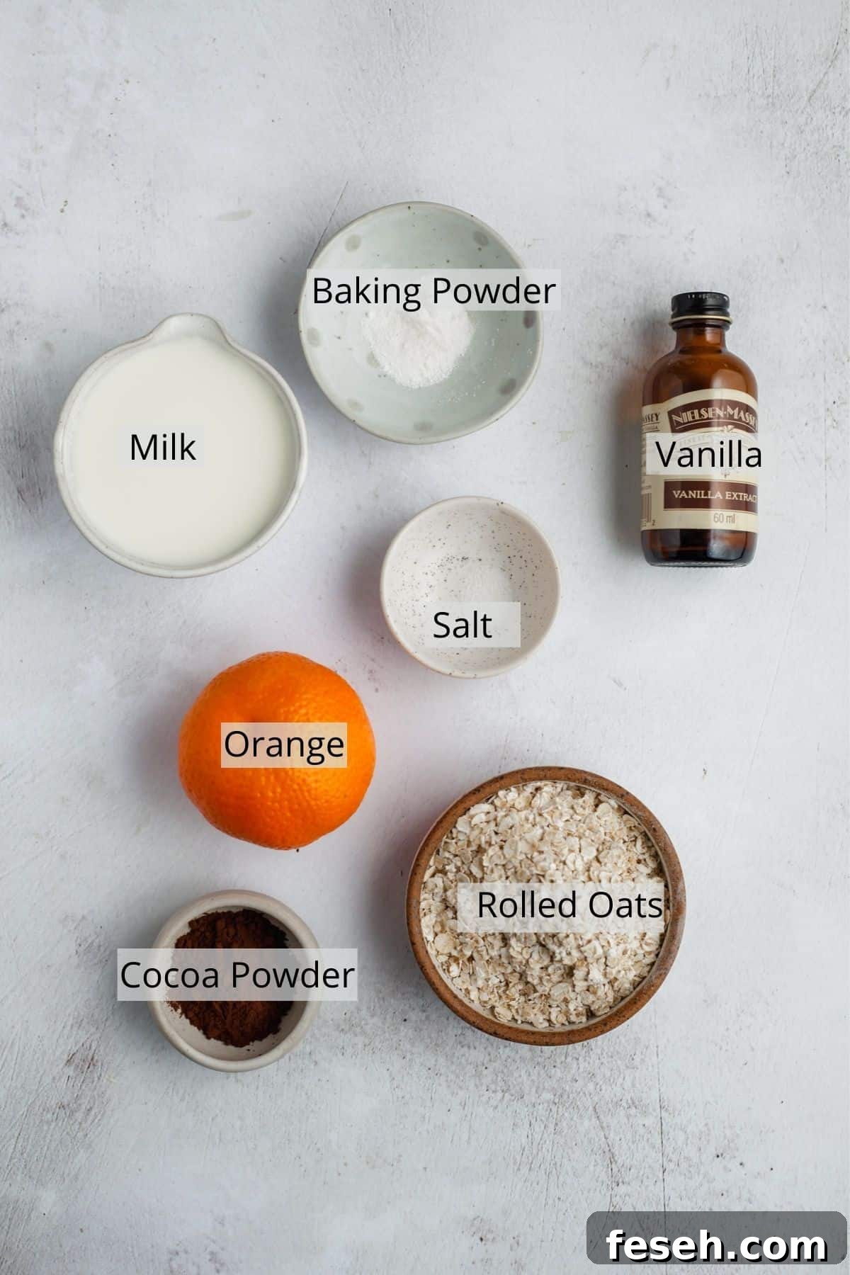 all the ingredients needed for chocolate orange oats, weighed out into small bowls.