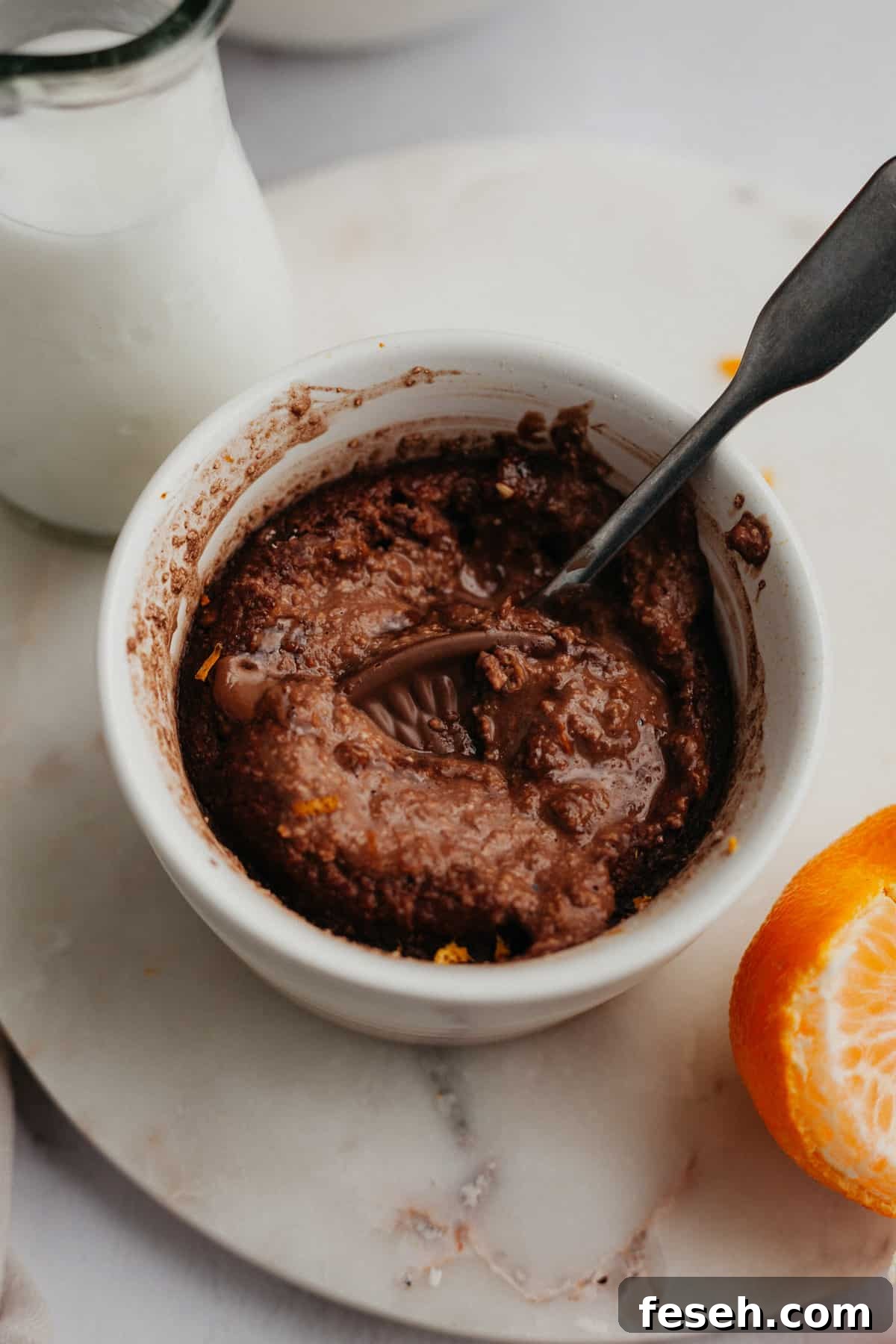 chocolate orange baked oats in a small white ramekin.