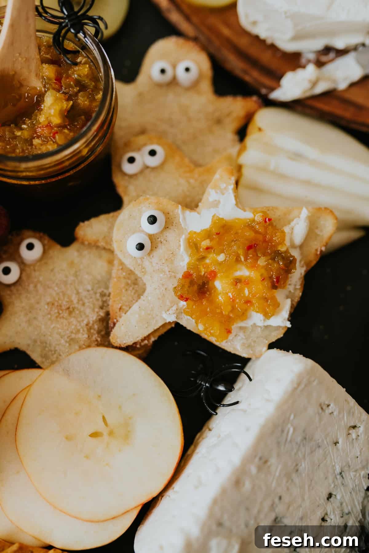 Cinnamon and sugar coated fried flour tortilla ghosts topped with cream cheese and jalapeño jelly.
