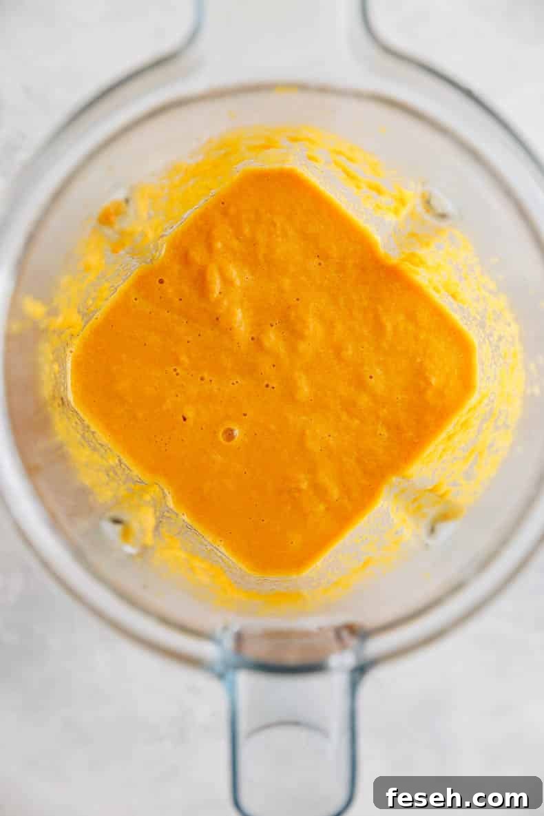 Ginger salad dressing blended up in a blender.