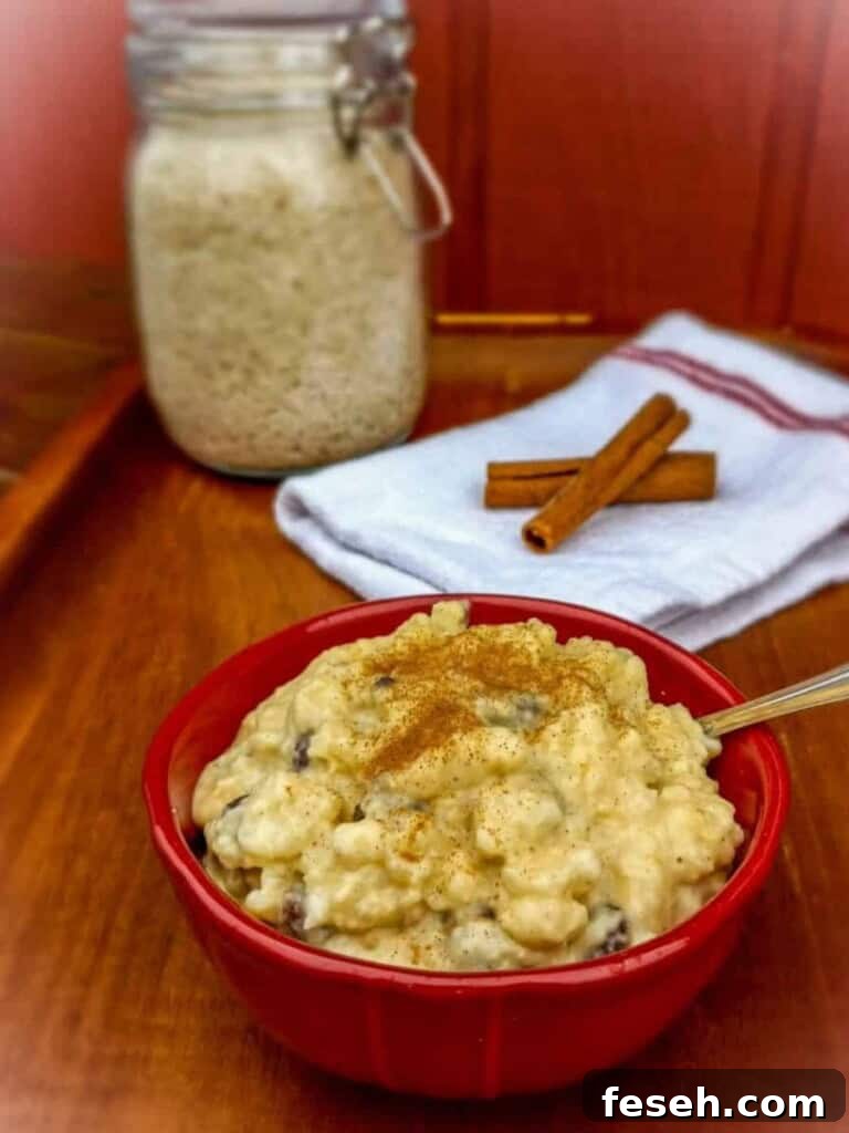 a bowl of creamy pudding, a jar of rice, and cinnamon sticks.