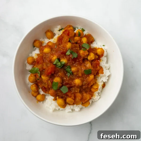 An overhead image of authentic chana masala in a bowl, ready for serving.