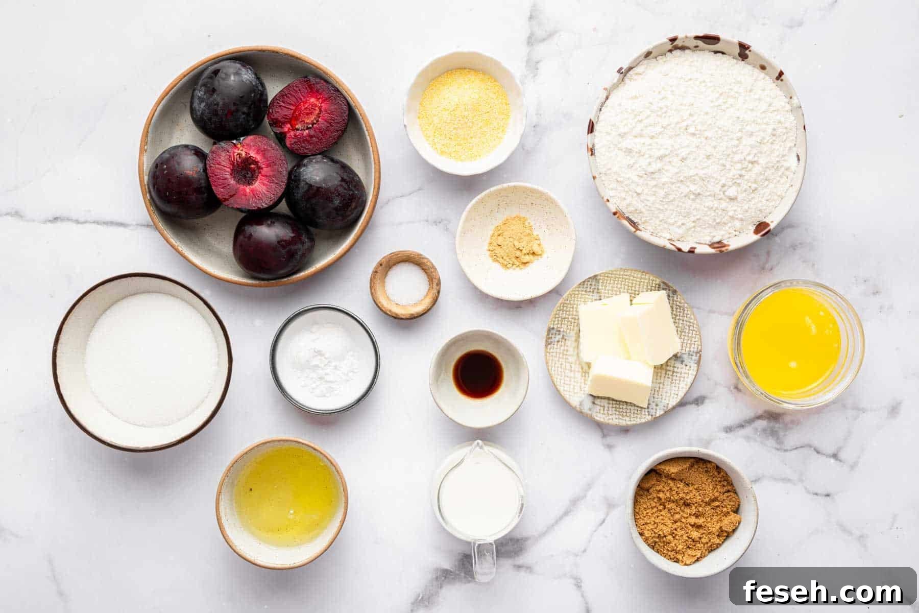 Bowl of fresh fruit, cornmeal, flour, melted butter, and brown sugar on kitchen counter.
