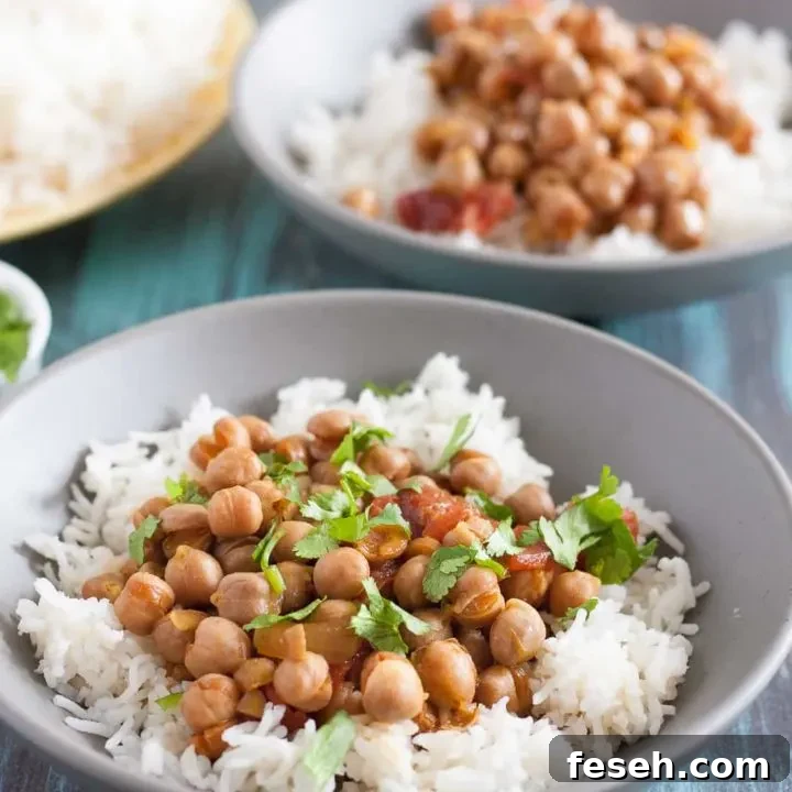 This easy slow cooker chickpea curry is a perfect, economical vegetarian dinner recipe! Recipe includes notes for making this in the Instant Pot too. * GoodieGodmother.com