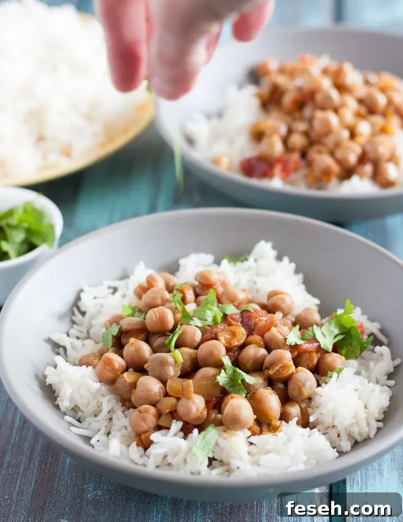 This easy slow cooker chickpea curry is a perfect, economical vegetarian dinner recipe! Recipe includes notes for making this in the Instant Pot too. * GoodieGodmother.com