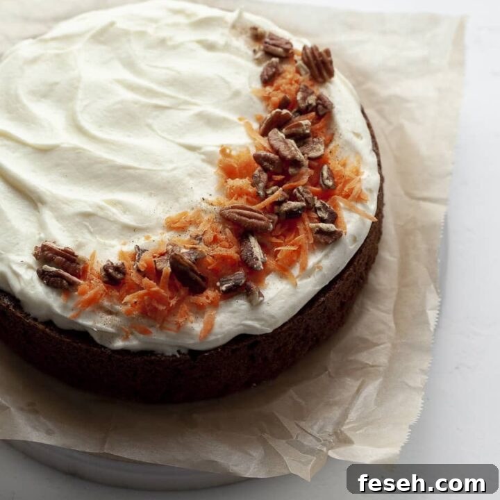 SIngle Layer Gluten Free Carrot Cake topped with cream cheese frosting, carrots and pecans