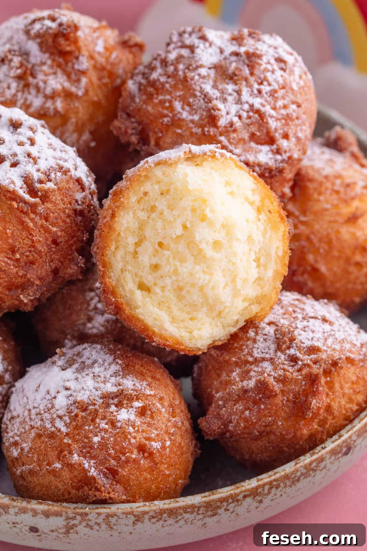 A cross section of a gluten free zeppole showing the texture inside.