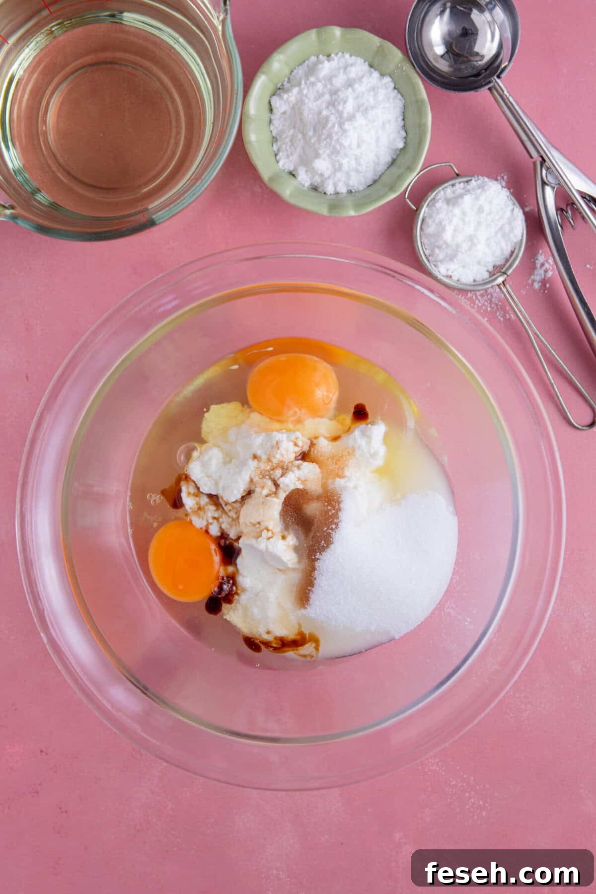 Process shot for gluten free zeppole showing the wet ingredients in a mixing bowl.
