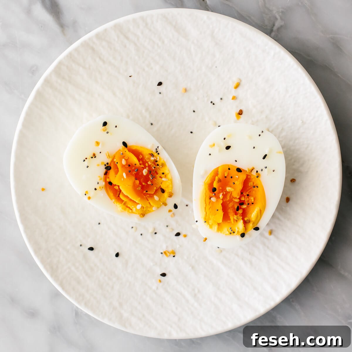 Boiled egg with seasoning on a plate