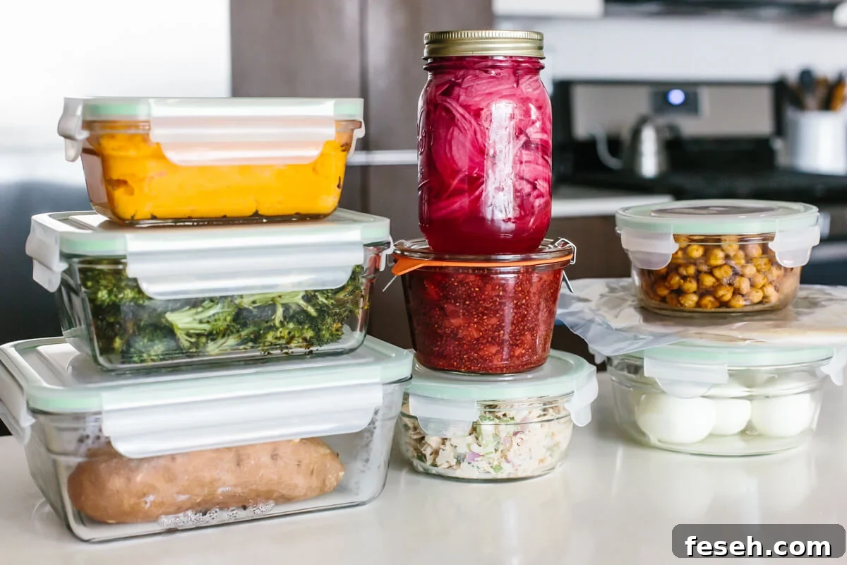 Stacked containers on a table for a healthy budget meal prep