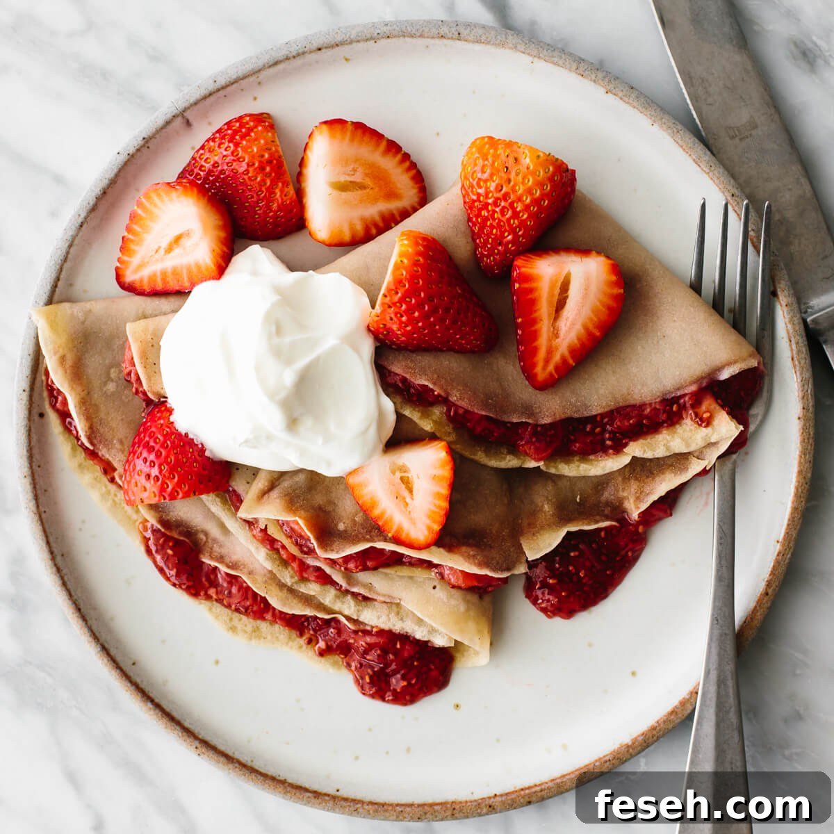 Strawberry crepes on a plate for a budget meal prep