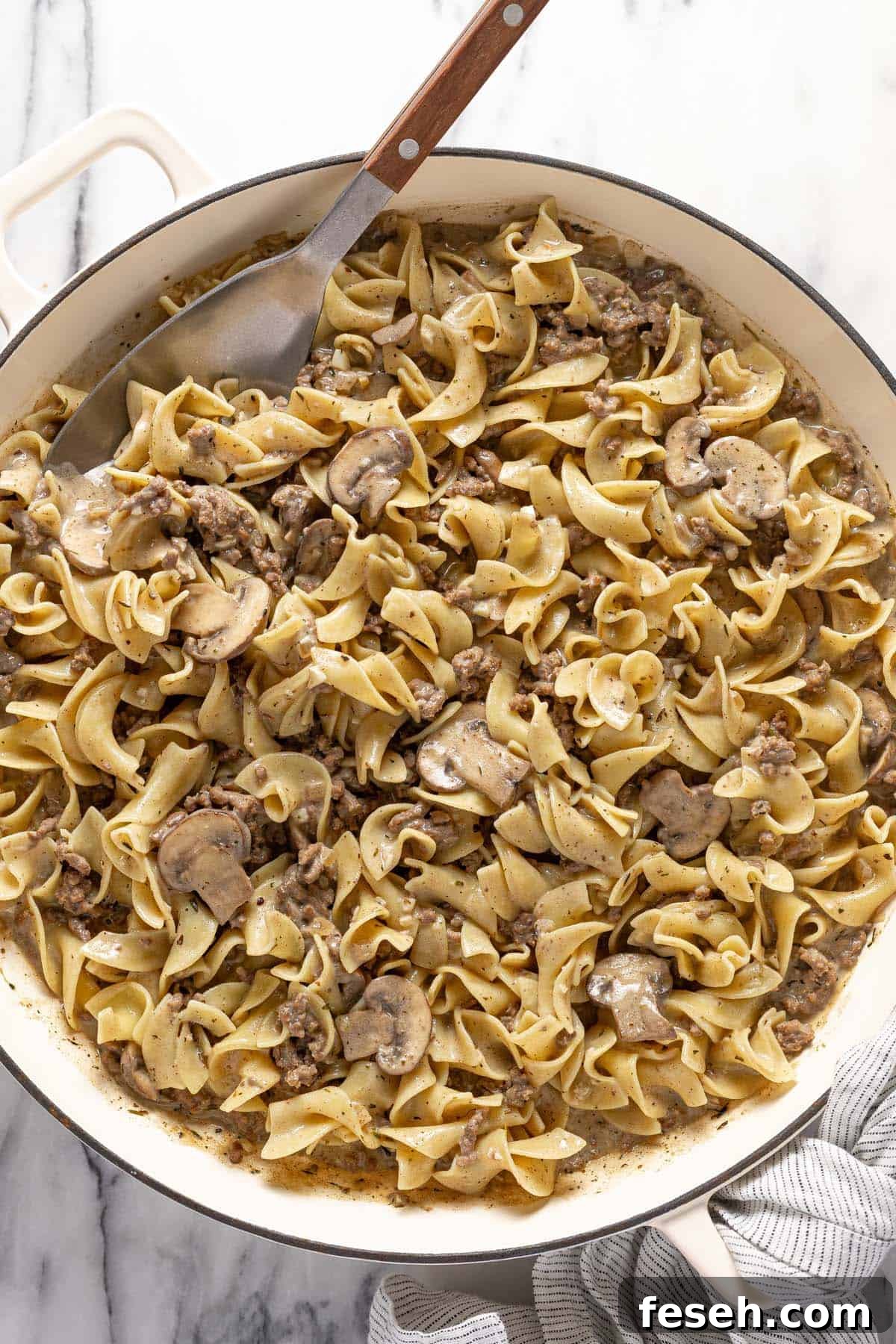 Large pan of ground beef stroganoff with mushrooms. 