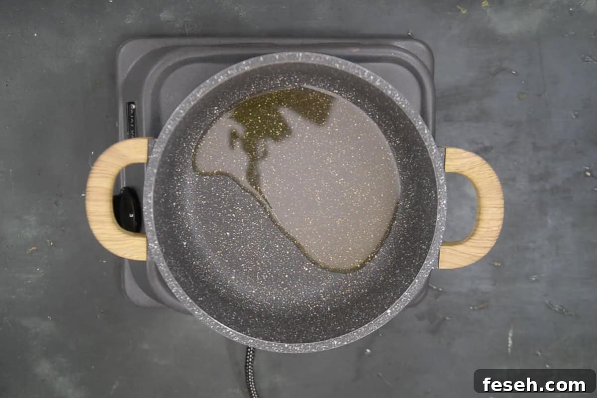 Vegetable oil heating in a pan.