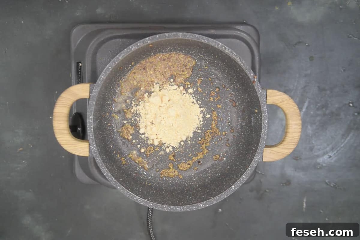Besan added in the pan.