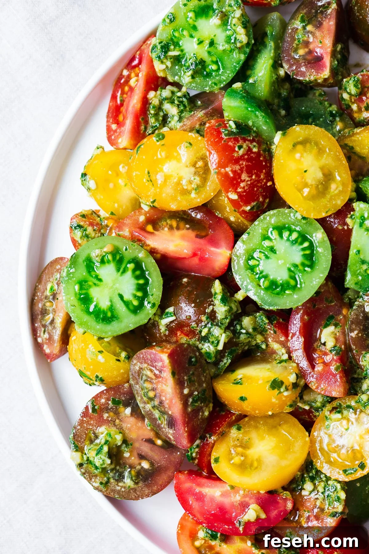 12 Great Pine Nut Substitutes for Pesto You’ll Love 8 Heirloom tomato salad with homemade vegan basil pesto.
