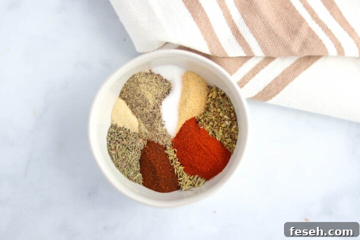 all spices for seasoning in a white bowl separated.