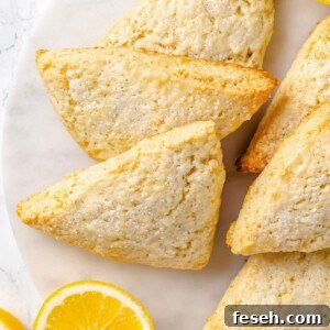 Lemon scones with golden brown edges and lightly crisp exterior from proper baking.
