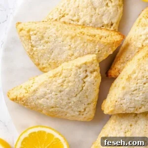 Lemon scones with golden brown edges and lightly crisp exterior from proper baking.
