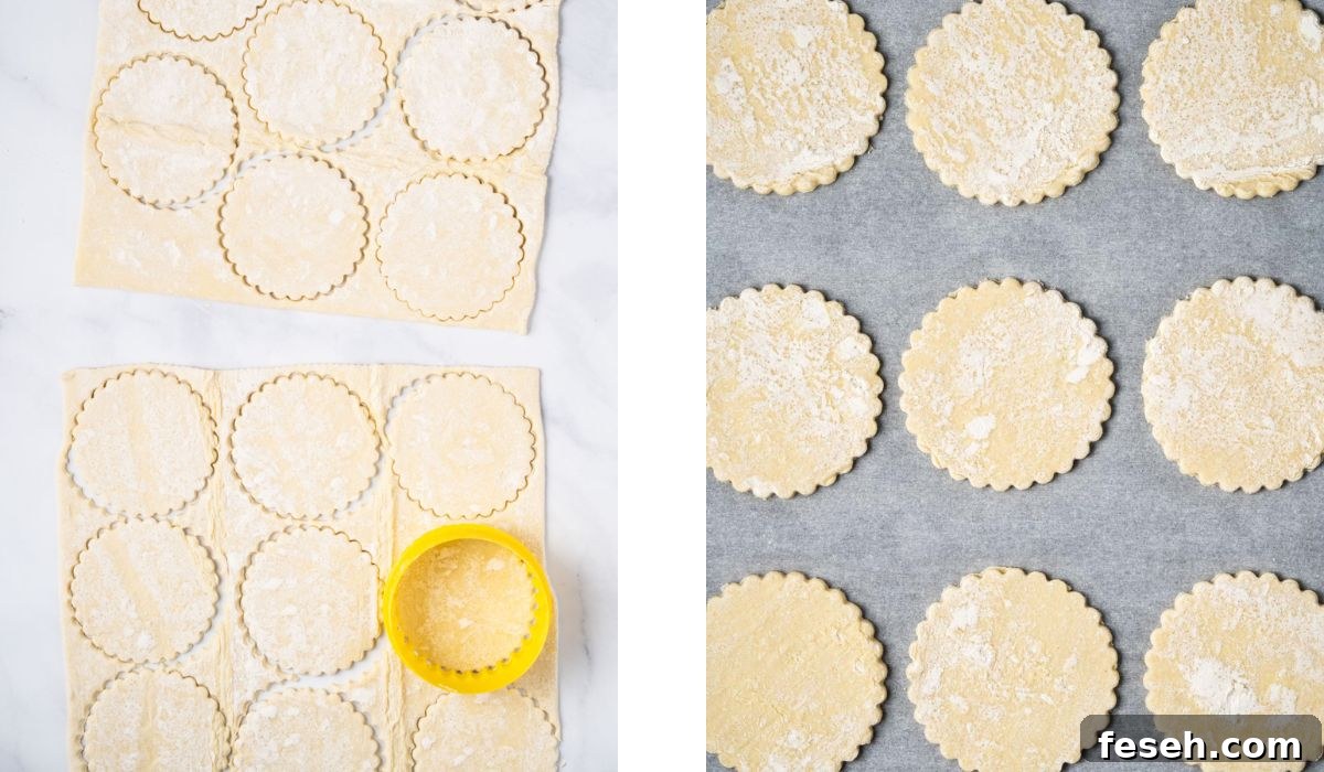 Cutting out the puff pastry sheets into circles with a cookie cutter and placing them onto a parchment-lined tray.