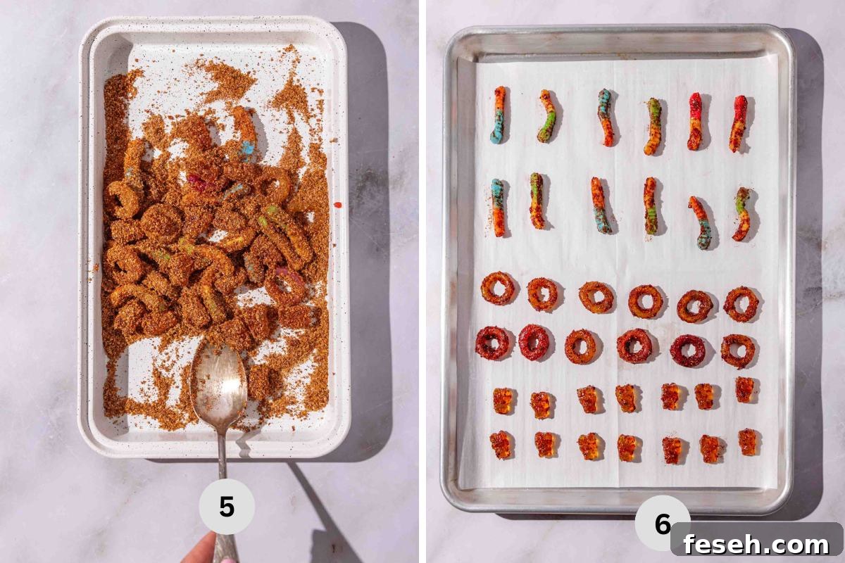 coating the candies in tajin and chili powder mix, then transferring to a baking sheet to dry.