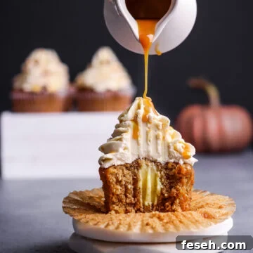 Pouring caramel syrup over hazelnut cupcake