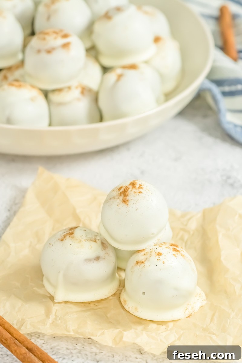 Pumpkin cake pops on a piece of parchment paper.