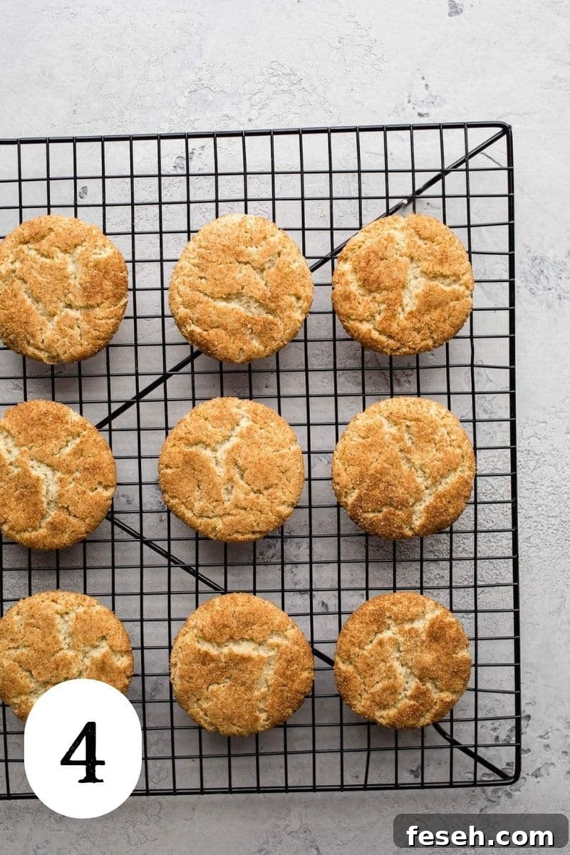 Gluten free snickerdoodles on a cooling rack.