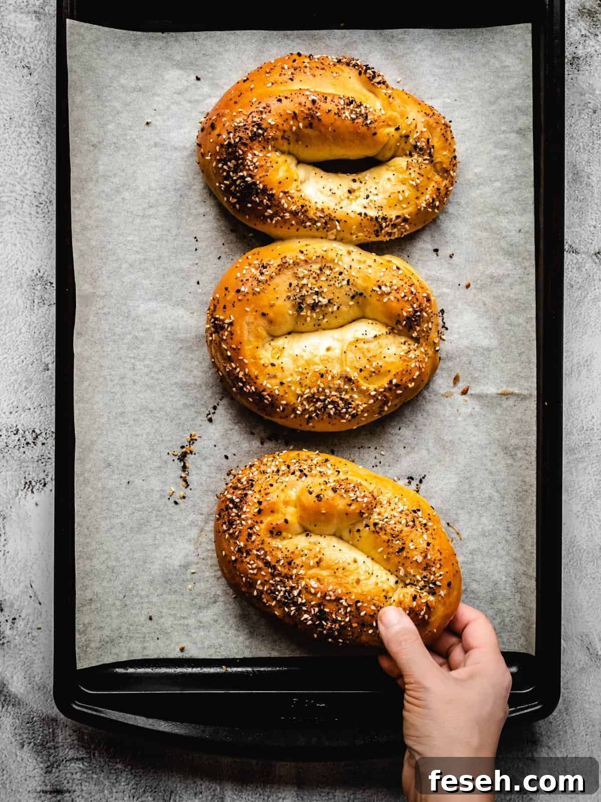grabbing for a homemade Jerusalem bagel