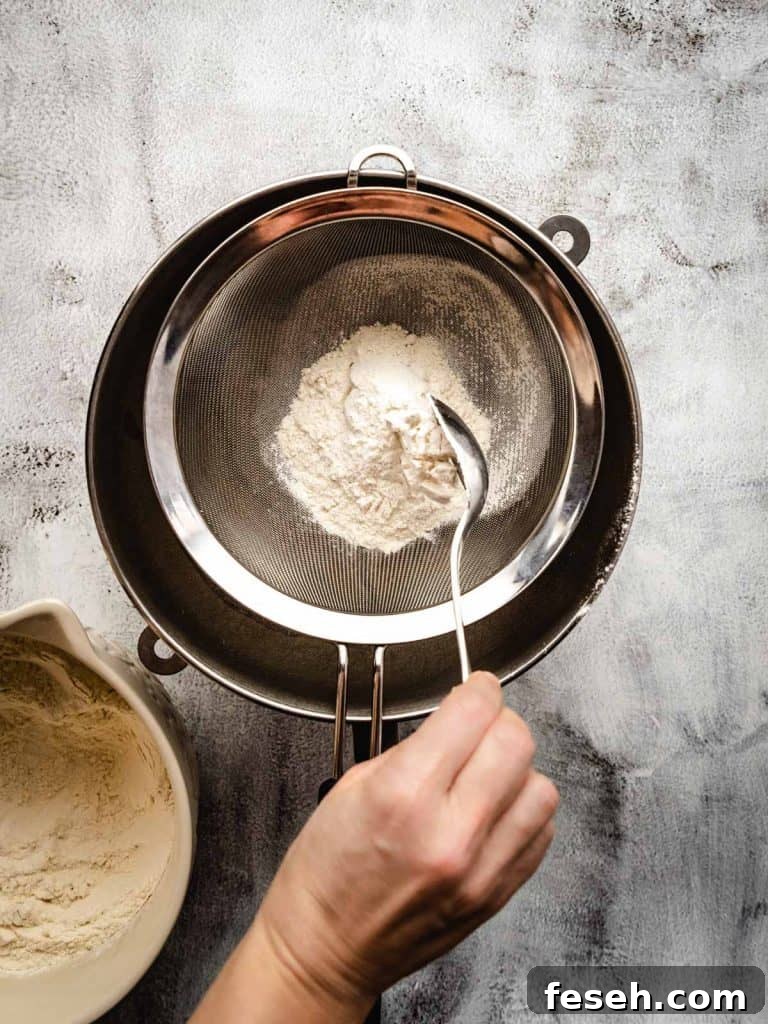 sifting flour to make bagels
