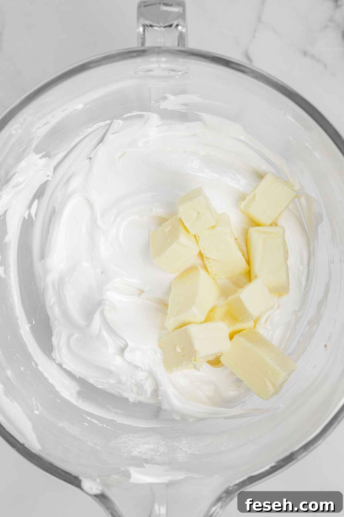 bowl with meringue and butter pieces