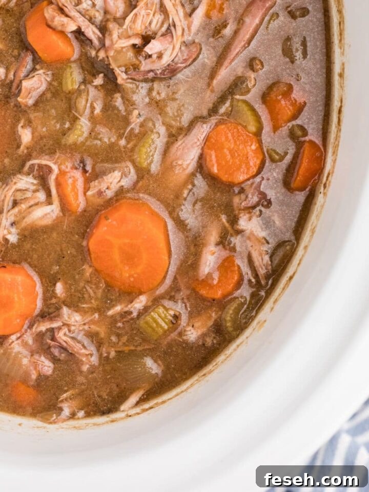 Overhead close up view of a slow cooker rabbit stew.