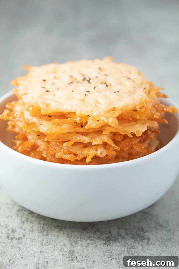 stack of parmesan crisps inside of white bowl