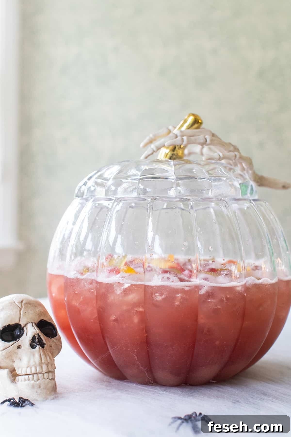 Virgin Halloween punch recipe with gummy bears in a spooky punch bowl.